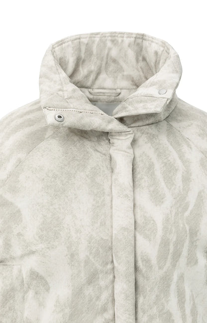 Veste matelassée entièrement recouverte d'un motif abstrait